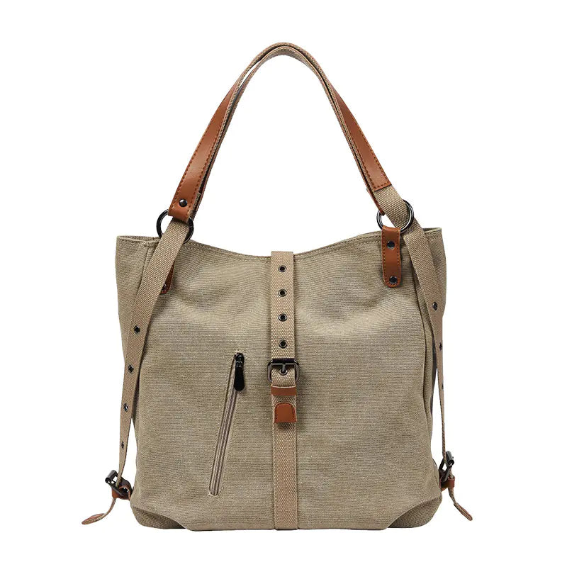 Beige handbag with brown straps on a white background