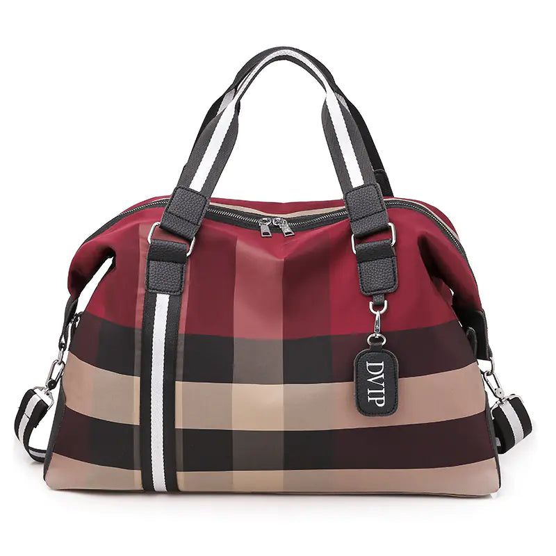 Plaid patterned handbag with visible brand tag on a white background