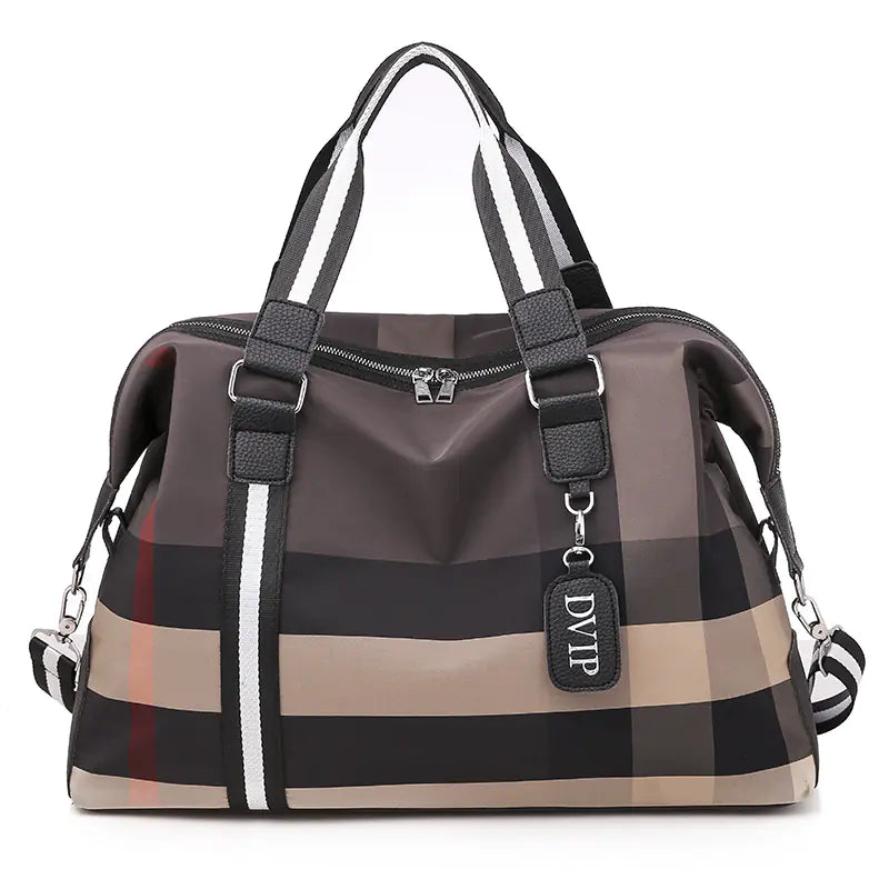 Plaid patterned handbag with visible brand logo on a white background