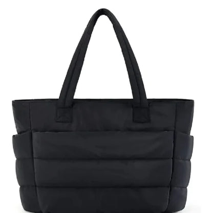Black quilted handbag on a white background