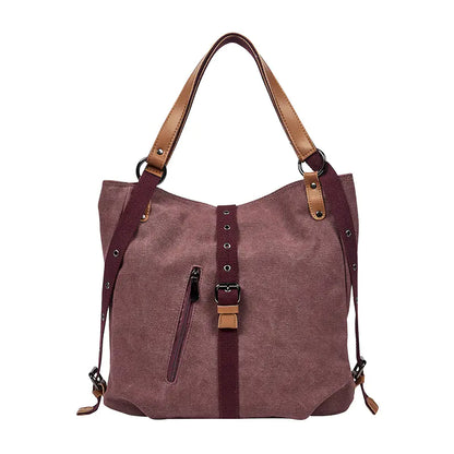 Brown handbag with leather straps on a white background